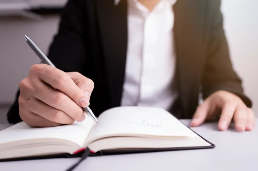 21_an-of-a-person-reading-a-financial-book-with-notes-taken-1745223517658